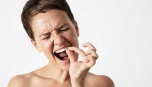 O que significa sonhar com dente podre caindo?