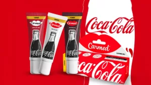 Carmed x Coca-Cola: duo lança hidratantes labiais em tons Vermelho e Marrom